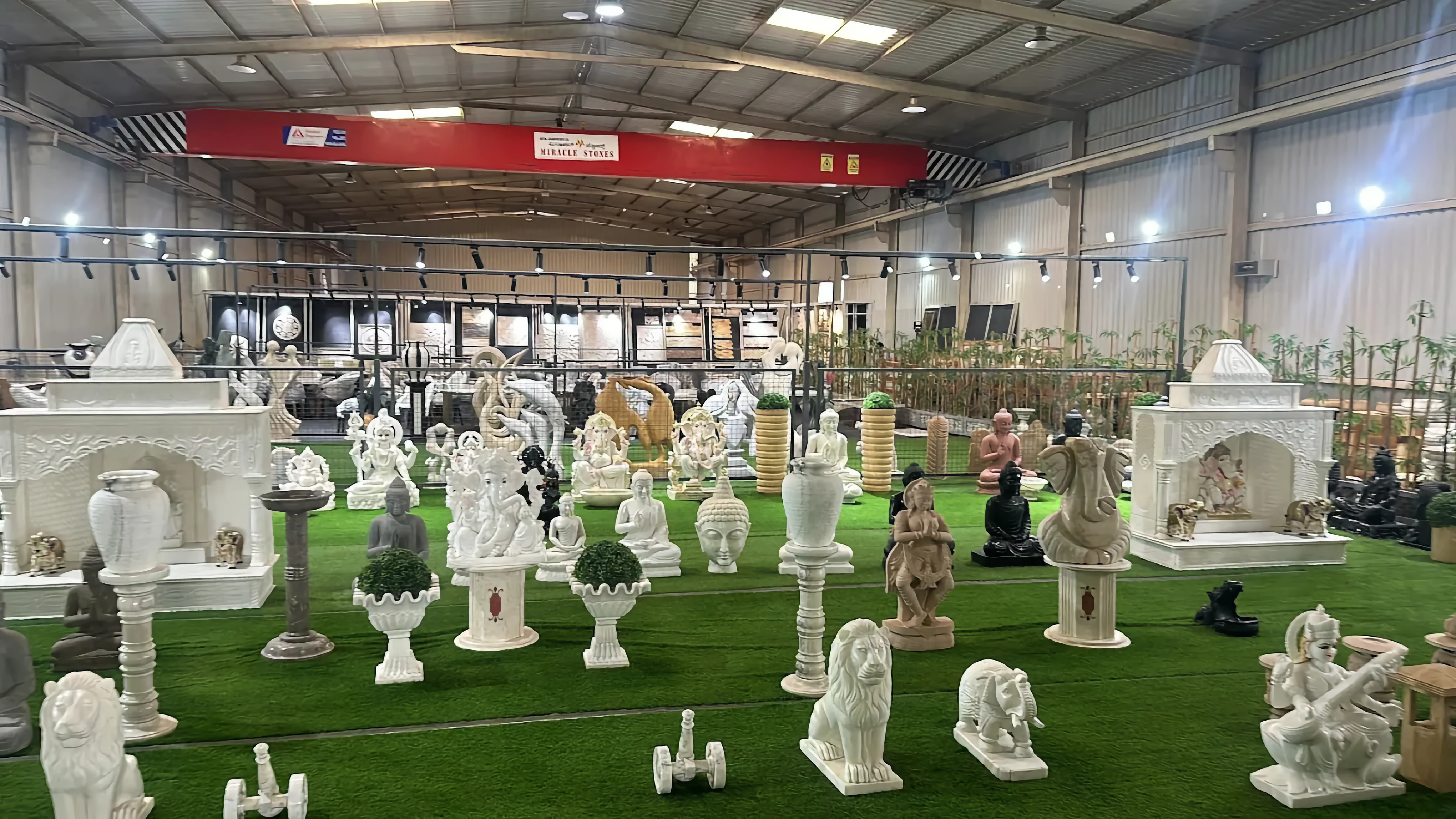 Artisan chiseling a marble idol inside the Jigani workshop